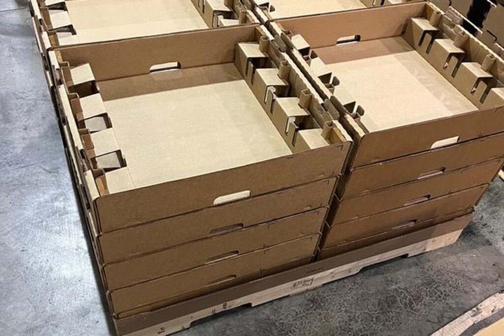 Layered-tray corrugated assemblies stacked on pallet