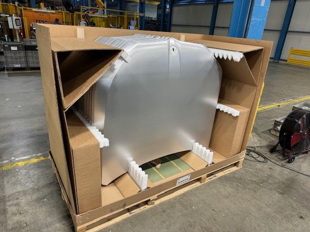 Large corrugated container with automotive hood panel