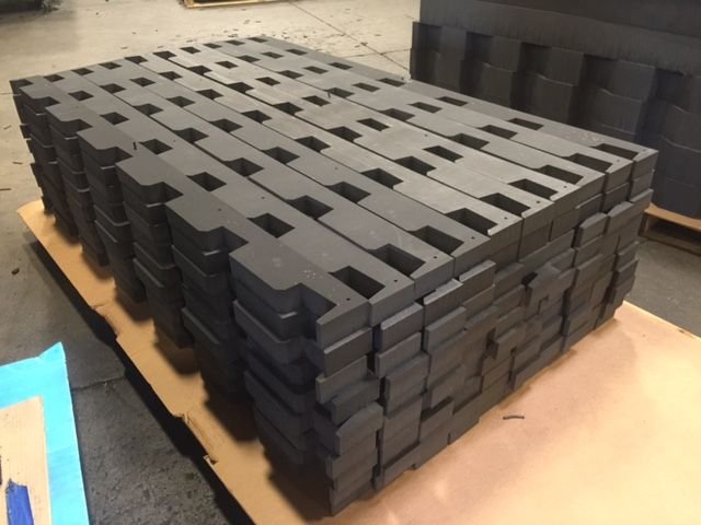 Machined XLPE foam dunnage stacked in layers on a pallet