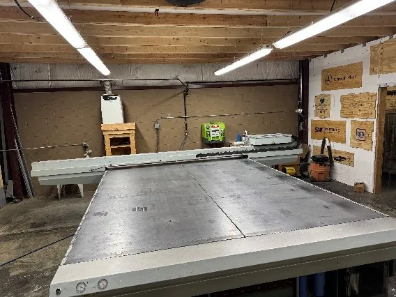Large-format Canon flatbed printer table in the shop